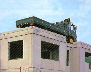 レスコハウスの耐荷重性能をあらわす画像。WPC工法による建物の屋上にトラックが乗っている。